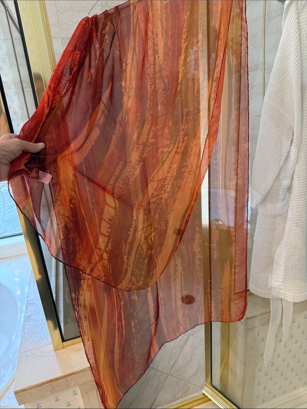 Made in Italy, hand dyed silk scarf.  Sheer Orange-Red and Bronze pattern.